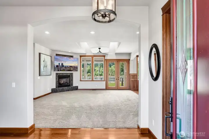 Large Entry to the Living Room. 1/4 Bath to the right and a coat closet to the left.