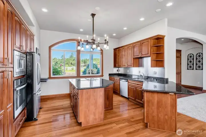 Walk around Island with room to move! Granite, Stainless Appliances, Double Sinks, Breakfast Bar and Large window with View of the Front Yard!