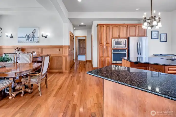 Down the hall is the Pantry, Laundry Room with Garage Access, Two Bedrooms with Outside Acess, and a Full Bath.