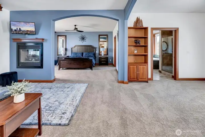 The Primary Suite you won't want to leave! Has its own Living Room with 2 sided Gas Fireplace, 5 Piece En Suite, Room for Workout Area, Walk in Closet and Door to the Deck.