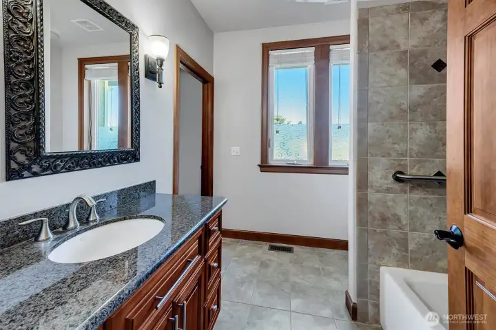 Well Appointed Full bath that serves the 2 Guest Bedrooms. Has 2 entry doors and the one on the left is attached to the larger of the 2 Guest Bedrooms. Would make a great 2nd Primary!