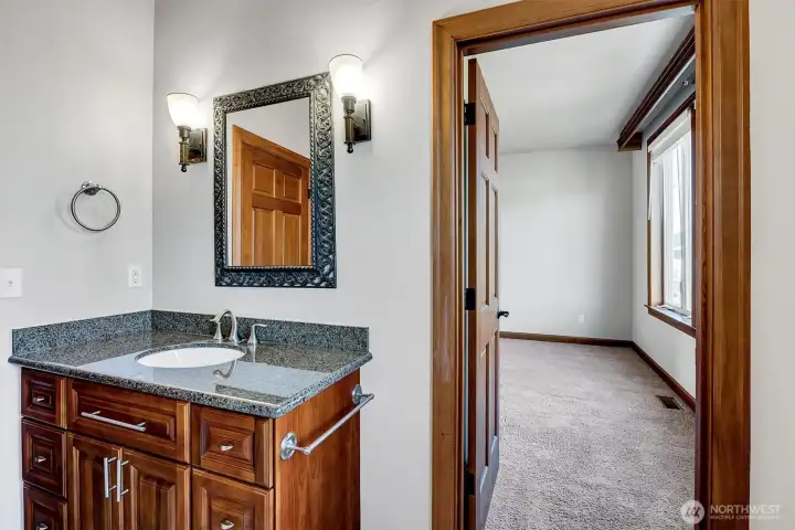 Door leads to the larger of the 2 Guest Bedrooms. So easily a 2nd Primary.