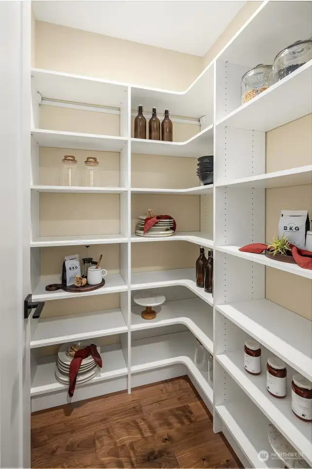 Walk-in pantry off of kitchen - Photos of the Alabaster model home, used for representational purposes only. All colors, finishes, cabinetry, and design features will vary.