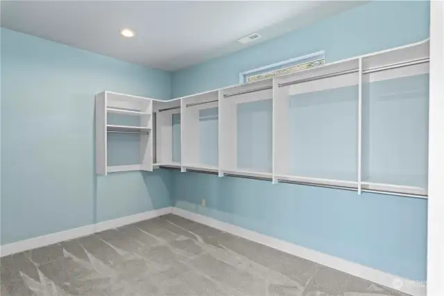 Primary bedroom walk in closet