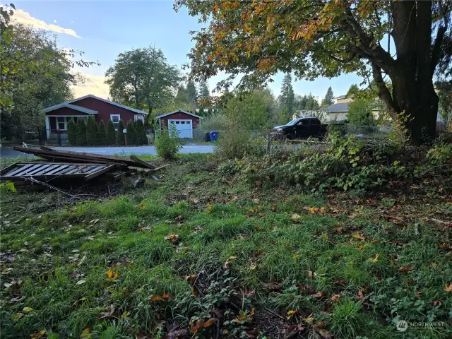 Facing neighbor's home across the street. Wood pile will be cleaned up