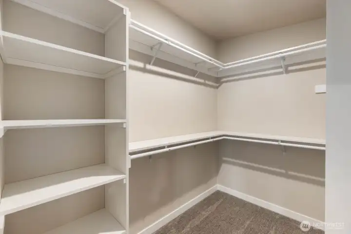 One of two primary walk in closets One of two primary walk in closets