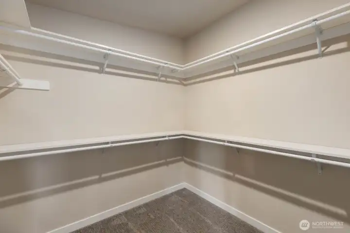 One of two primary walk in closets One of two primary walk in closets