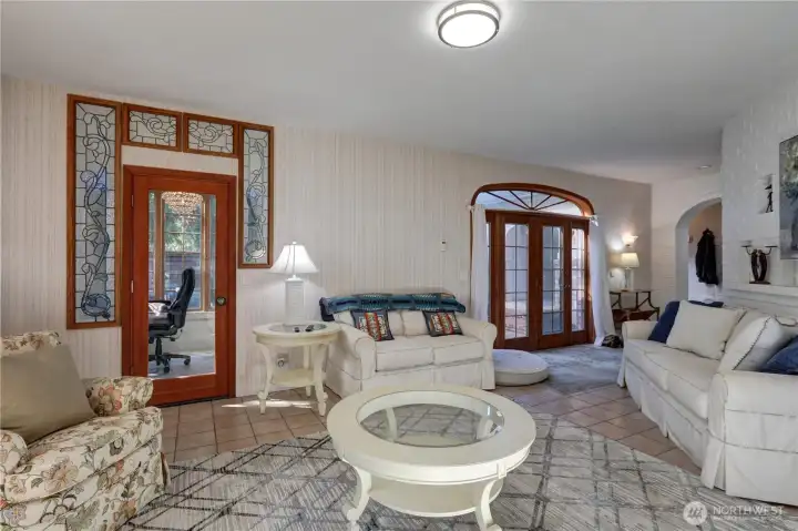 Den on the Left & French Doors to the Courtyard on the Right.