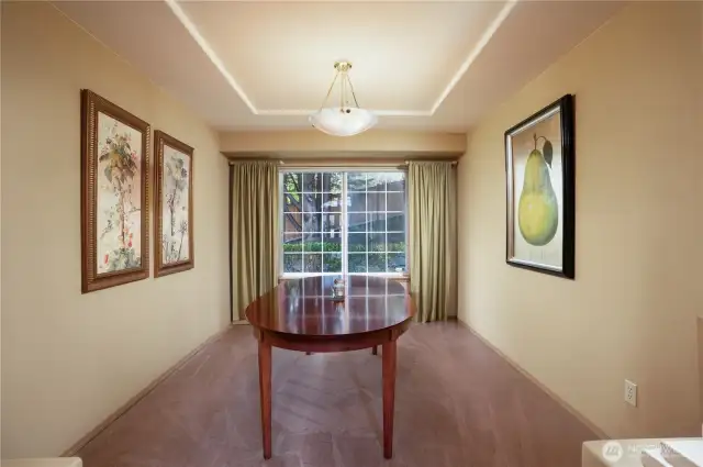 Through the columns is a generously sized formal dining room with large picture window for more of that glorious natural lighting.