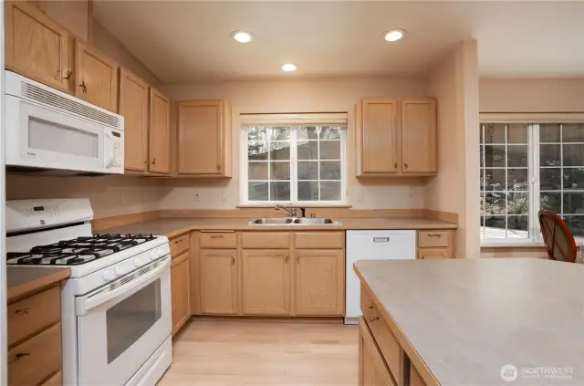 Tons of counter space and lots of cupboards allow for easy kitchen life.