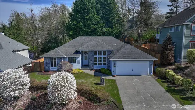 The lovely lines of this multi hipped roof add to the architectural detailing of this charming home.