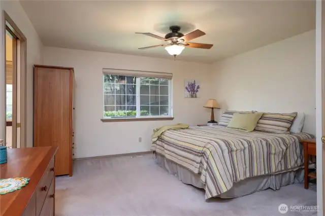 Another view of the primary with the door to the ensuite bathroom shown to the left.