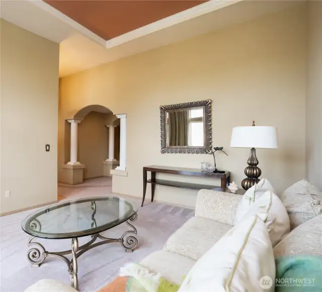 Entering we are greeted with columns, arches, and coffered ceilings.  Not pictured is the entry way- no walking directly into living spaces is always preferred.