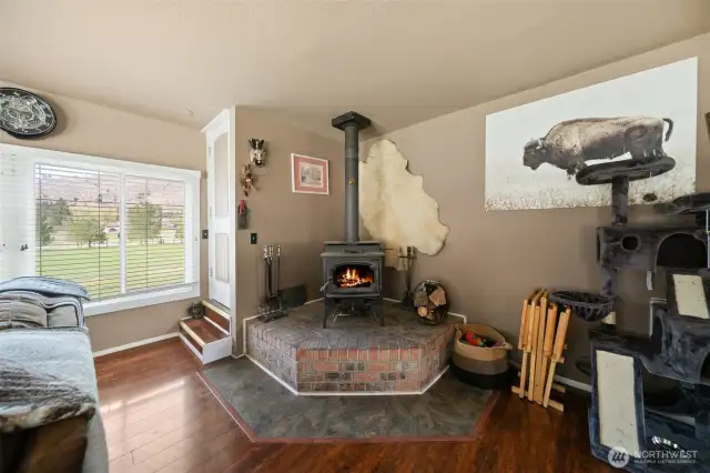 Woodstove and door to upstairs. Upstairs is unfinished, but could be finished for additional living space.