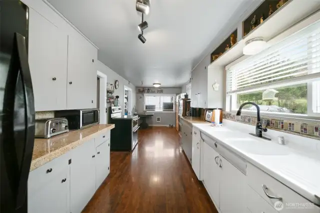 Kitchen with breakfast nook at the end.