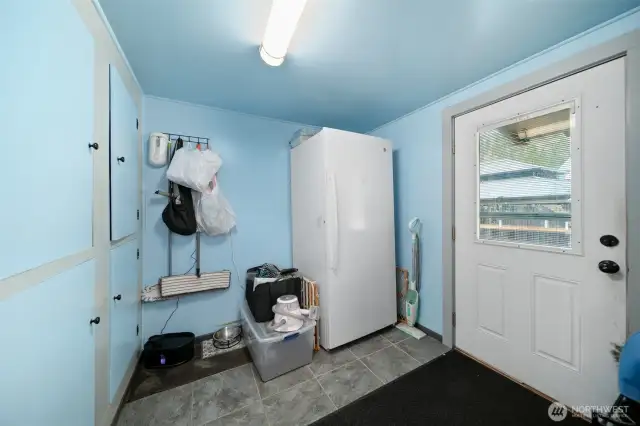 Mud room with back door.