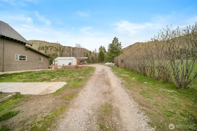 Driveway to the home, shop, and RV Cover. RV cover has hookups.