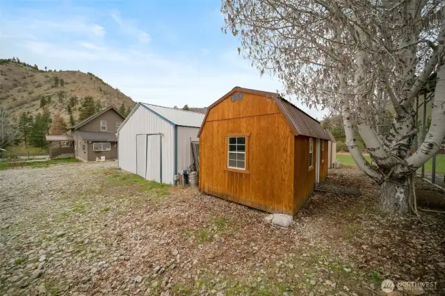 House, workshop, and large storage shed that has been converted to living/guest space. Has power, but no water.