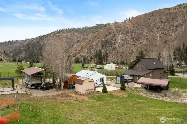 Outbuildings...RV cover, shed, additional living space, shop, carport, and then the house.