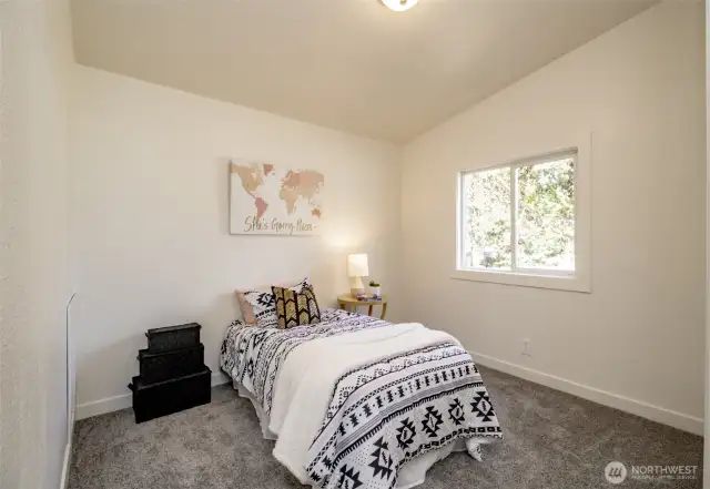 Vaulted ceilings grace the two West bedrooms.