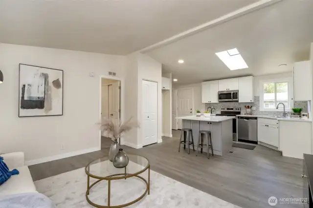 The primary bedroom is off the kitchen and family room