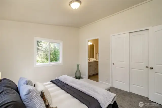 The primary suite offers abundant closet space.
