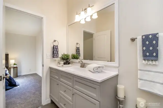 The new remodel of the primary suite includes double sinks and new cabinetry with abundant storage.