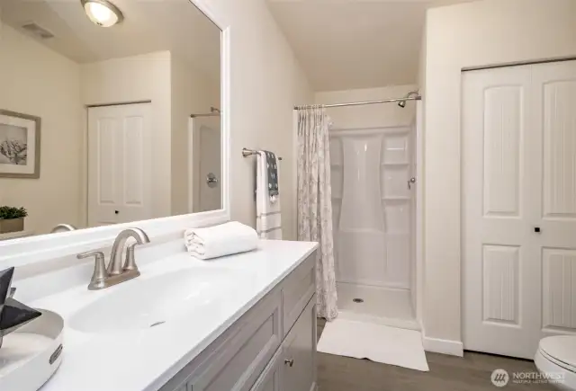 The linen closet is conveniently located in the primary bath.