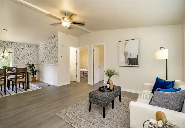 The large living room and dining room welcome you home.