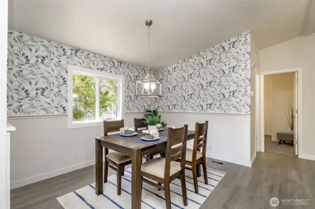 The dining room is accented with new designer wallpaper.