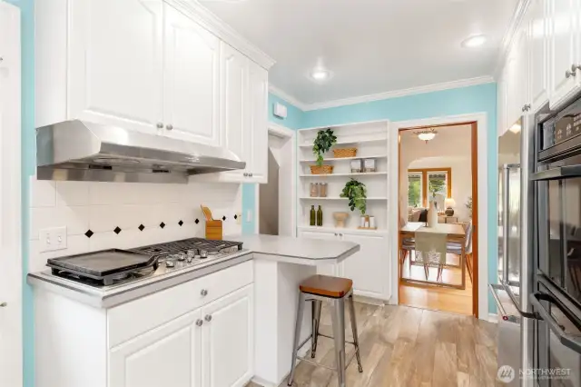 Uplifiting, efficient and inspiring kitchen that leads to back deck.