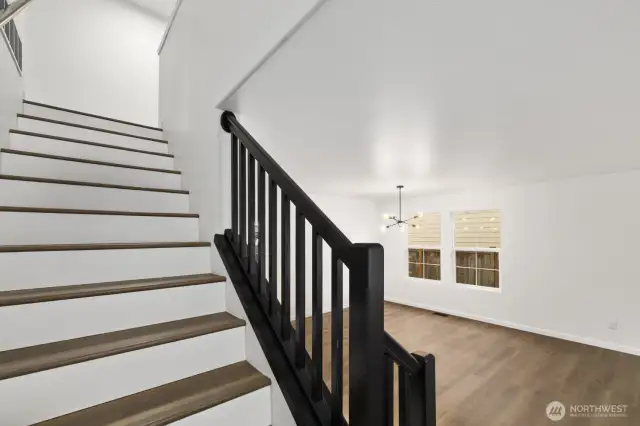 Upstairs features five true bedrooms, two full bathrooms, and ample storage space!