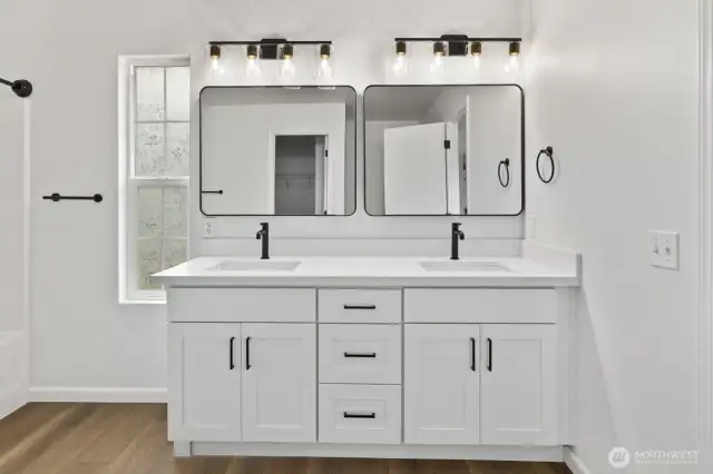Brand new! Stylish upgrades feature a sleek double vanity, along with new fixtures, mirrors, and lighting.