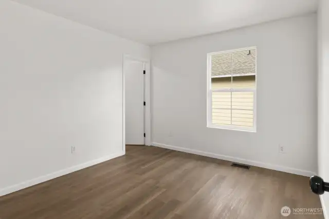 Another secondary bedroom, complete with a walk-in closet.