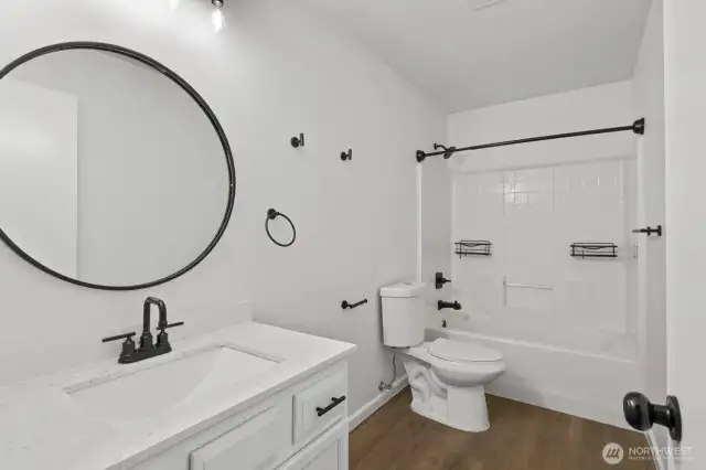 The full-size bathroom on the upper level is bright and beautifully updated.