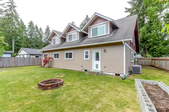 Large fully fenced yard, level with garden space, fruit trees,