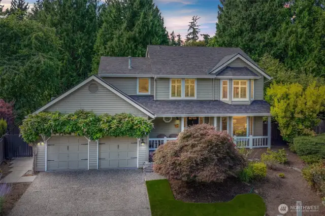 Tucked at the back of a peaceful cul-de-sac in Redmond’s sought-after English Hill neighborhood, this two-story home greets you with storybook curb appeal. Mature landscaping, wisteria-draped trellises, and a charming covered front porch offer an inviting first impression.