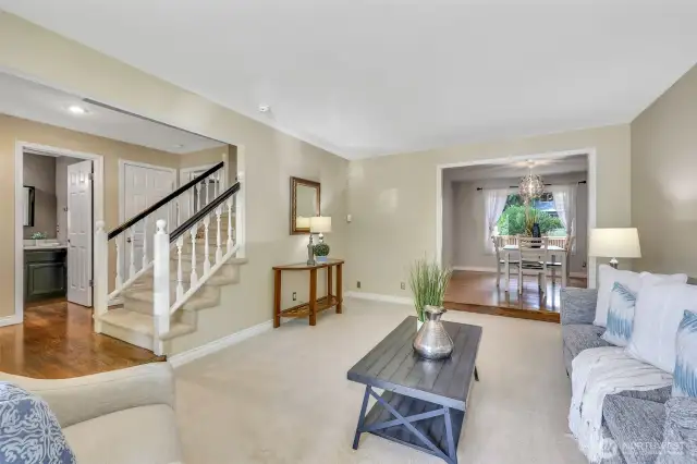 This spacious living area flows naturally into the formal dining room, making it ideal for entertaining. A thoughtfully placed powder bath is conveniently located near the entry.