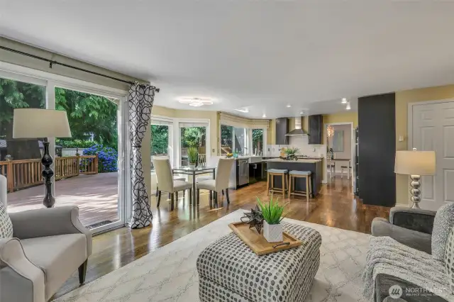 The open-concept layout connects the kitchen, dining nook, and family room, creating a spacious and fluid environment perfect for everyday comfort and entertaining.