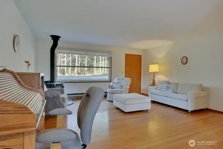From the dining room, you will see the open living room. That is the front door.