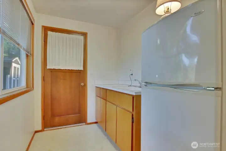 Backdoor access and second kitchen in bedroom #3.