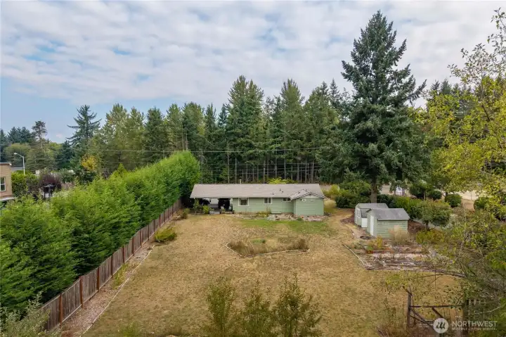 Two sheds included.