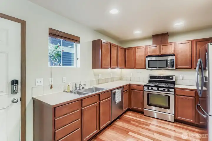 The kitchen is open to the dining room and has plenty of counter and storage space.
