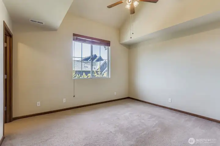 Primary bedroom on the 3rd floor. Great ceilings for architectural interest.