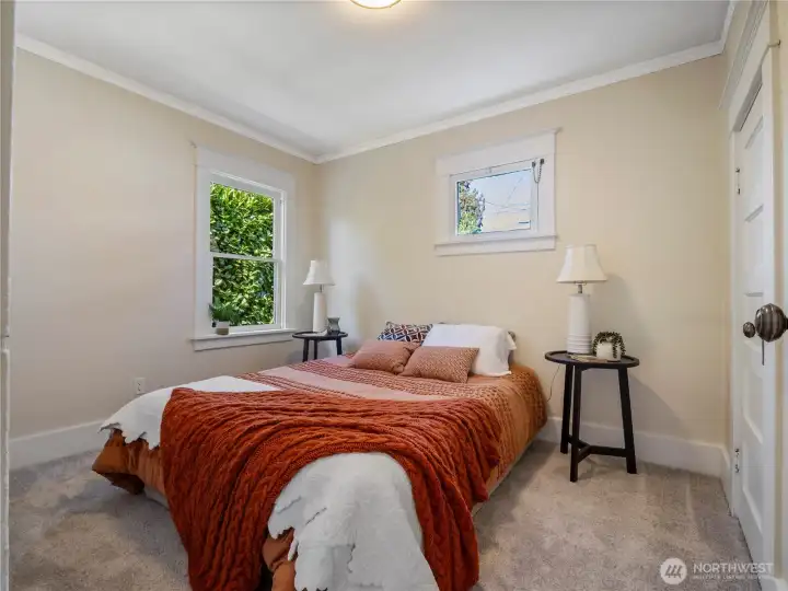 The bedroom on the main has a view of the garden.