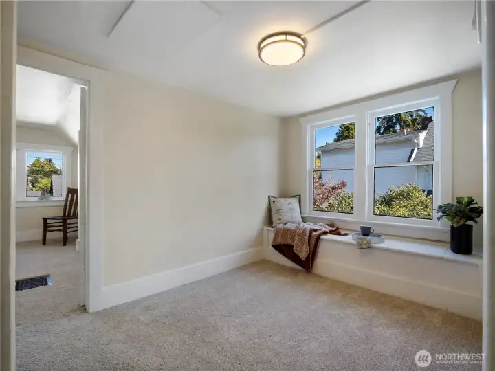 A nice place to curl up with a goid book. Lift the lid and you have storage underneath.