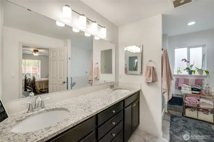 Even from the luxurious en-suite bathroom, this home is light and bright and the elegant touches throughout shine through.