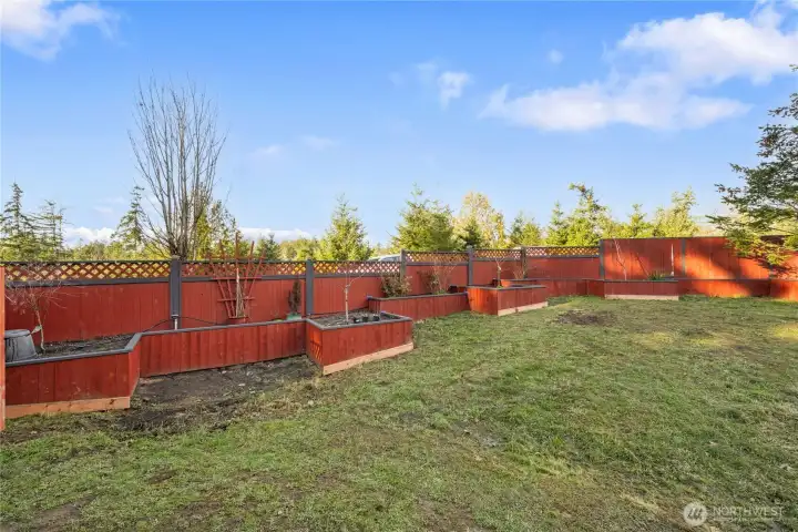 A network of expertly crafted raised beds provide homes for fruit trees, berries and more. Plus there's a greenhouse with power and water to enhance the abilities of your green thumb!