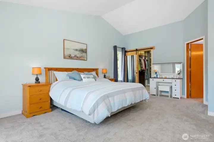 Upstairs: Primary suite with separate closets, private en-suite bathroom, and deck overlooking the lake