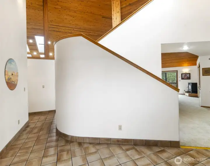 Gracious curved stairs up to the bonus area